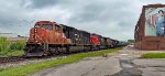 CN 5695 leads B774 west.